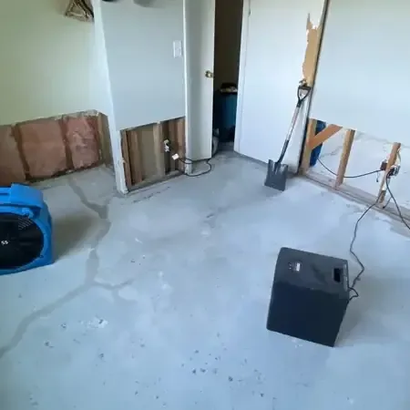 Portable drying equipment working inside a home during a water damage cleanup